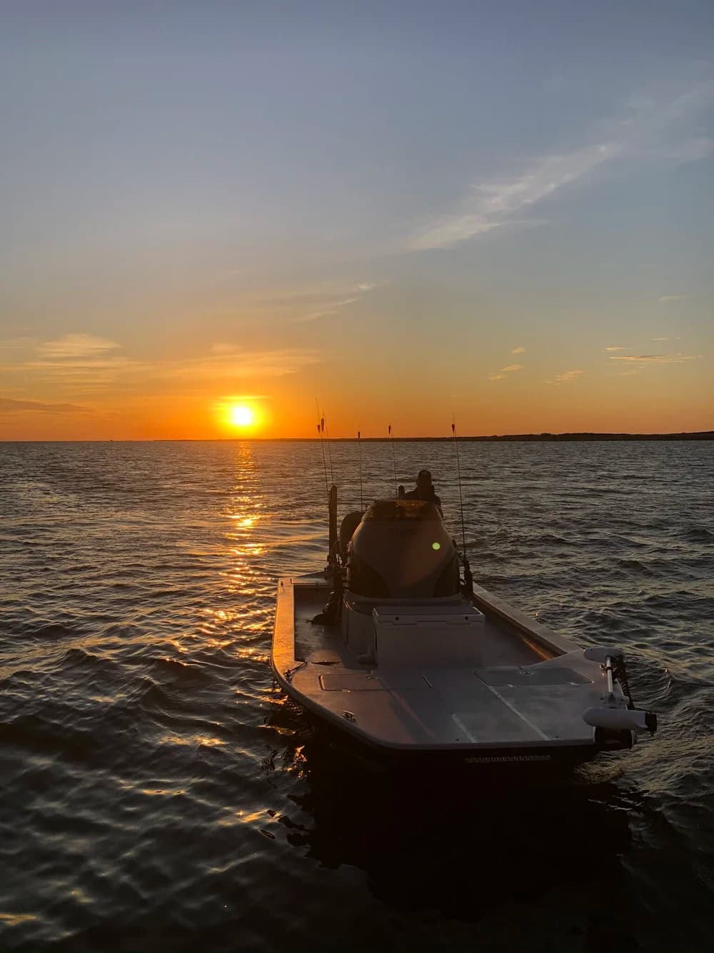 Boat at sunset during a Baffin Bay trip